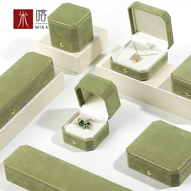 Sage green jewelry boxes with gold-tone trim